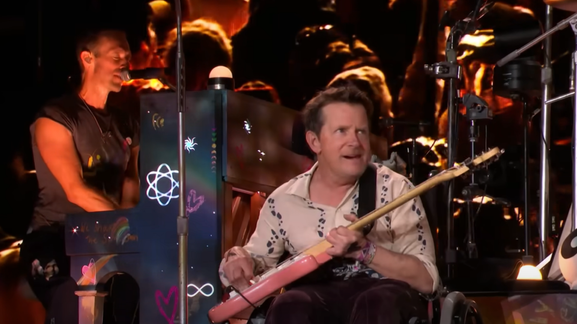 Michael J Fox Surprised 100k Fans By Shredding Guitar With Coldplay In His Wheelchair At Recent Gig